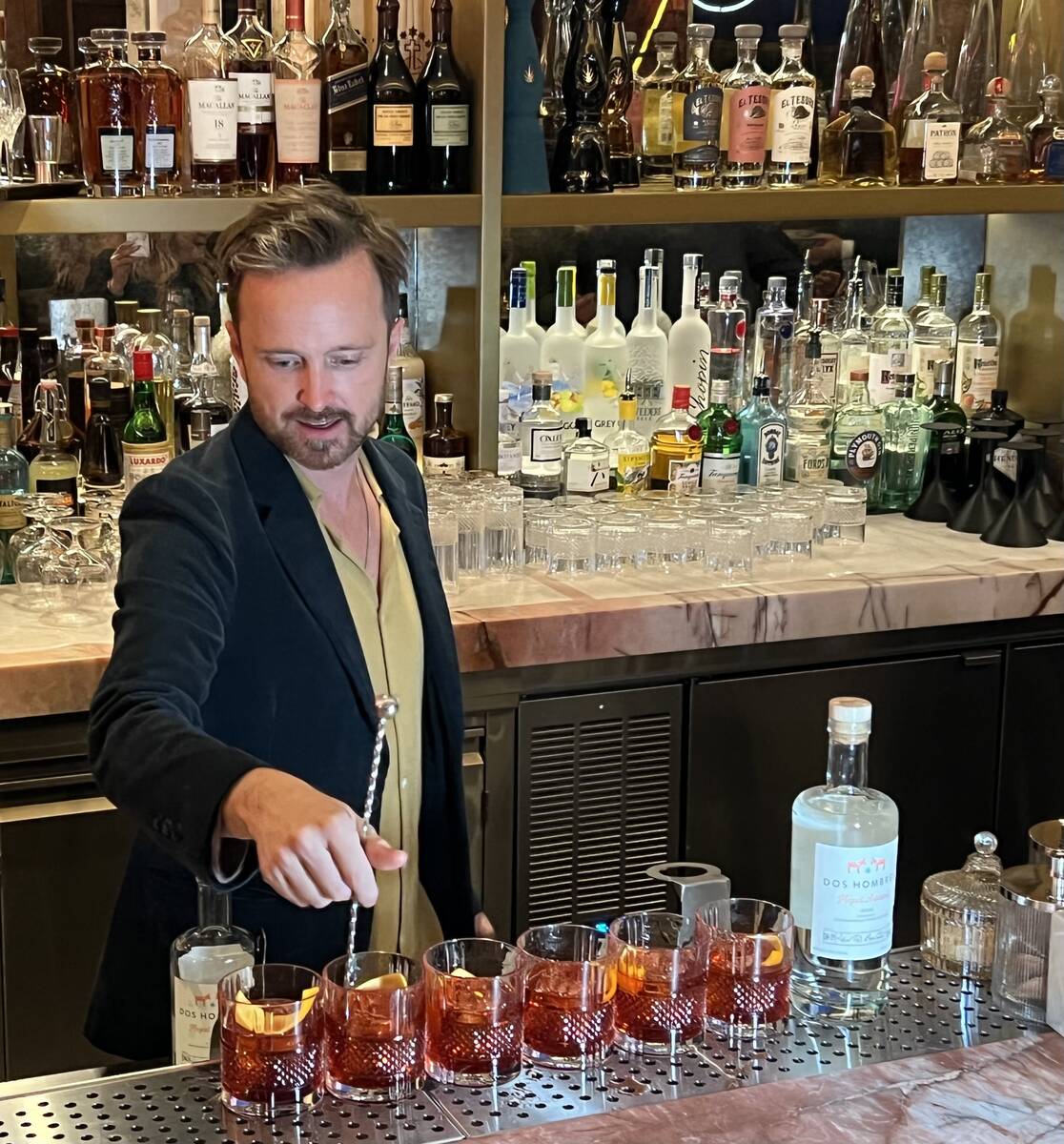"Breaking Bad" co-star Aaron Paul mixes drinks with his Dos Hombres mezcal at Carversteak at R ...