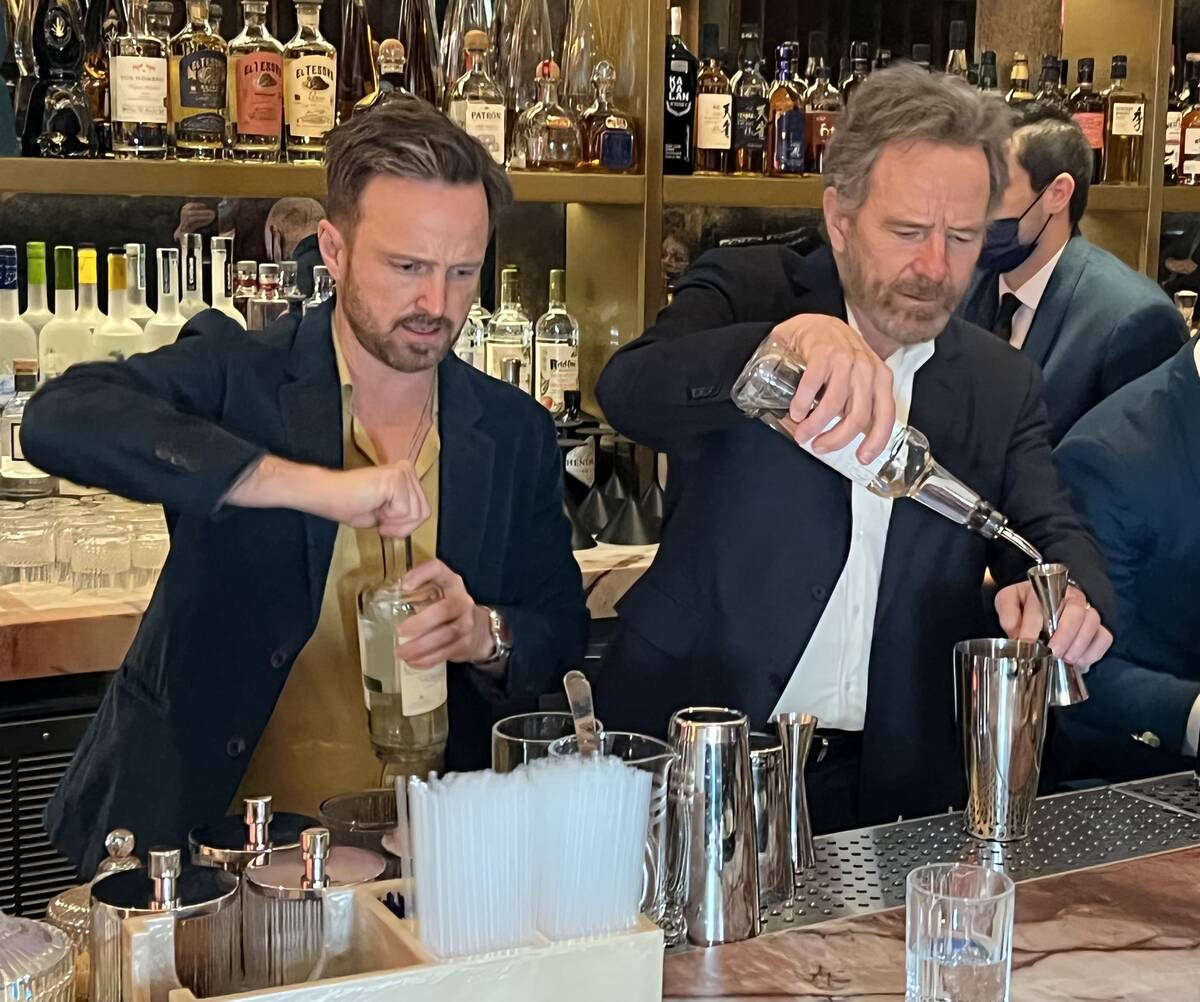 "Breaking Bad" co-stars Aaron Paul and Bryan Cranston mix drinks with their Dos Hombres mezcal ...