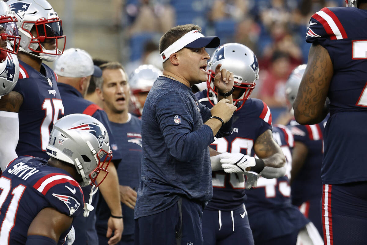New England Patriots offensive coordinator Josh McDaniels talks to the offense before an NFL pr ...