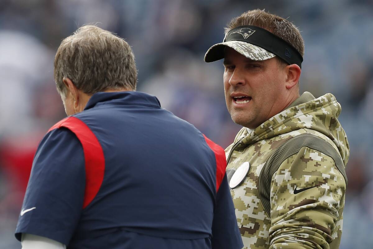 New England Patriots offensive coordinator Josh McDaniels, right, talks with head coach Bill Be ...