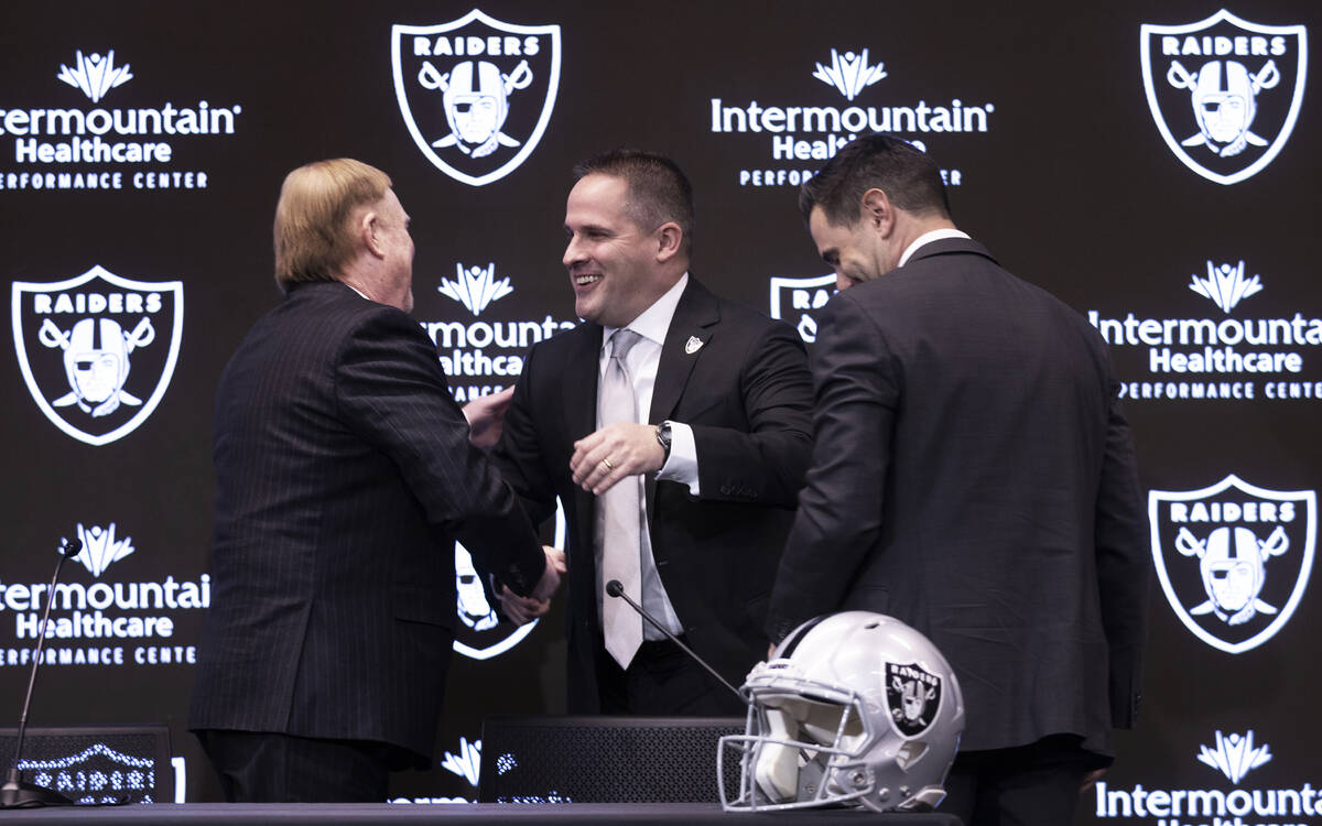 Raiders head coach Josh McDaniels, right, greets Raiders general manager Dave Ziegler during a ...