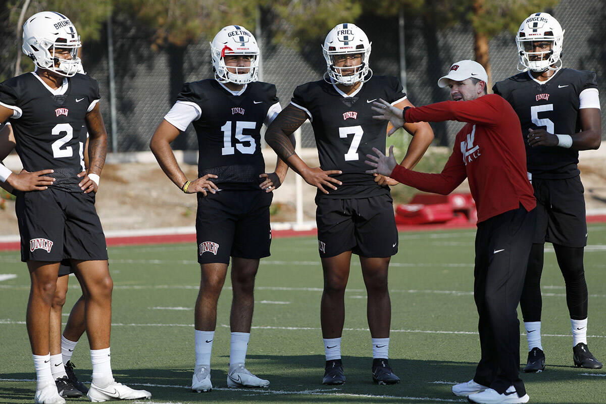 UNLV Rebels quarterbacks Doug Brumfield (2), Matthew Geeting (15), Cameron Friel (7), Justin Ro ...