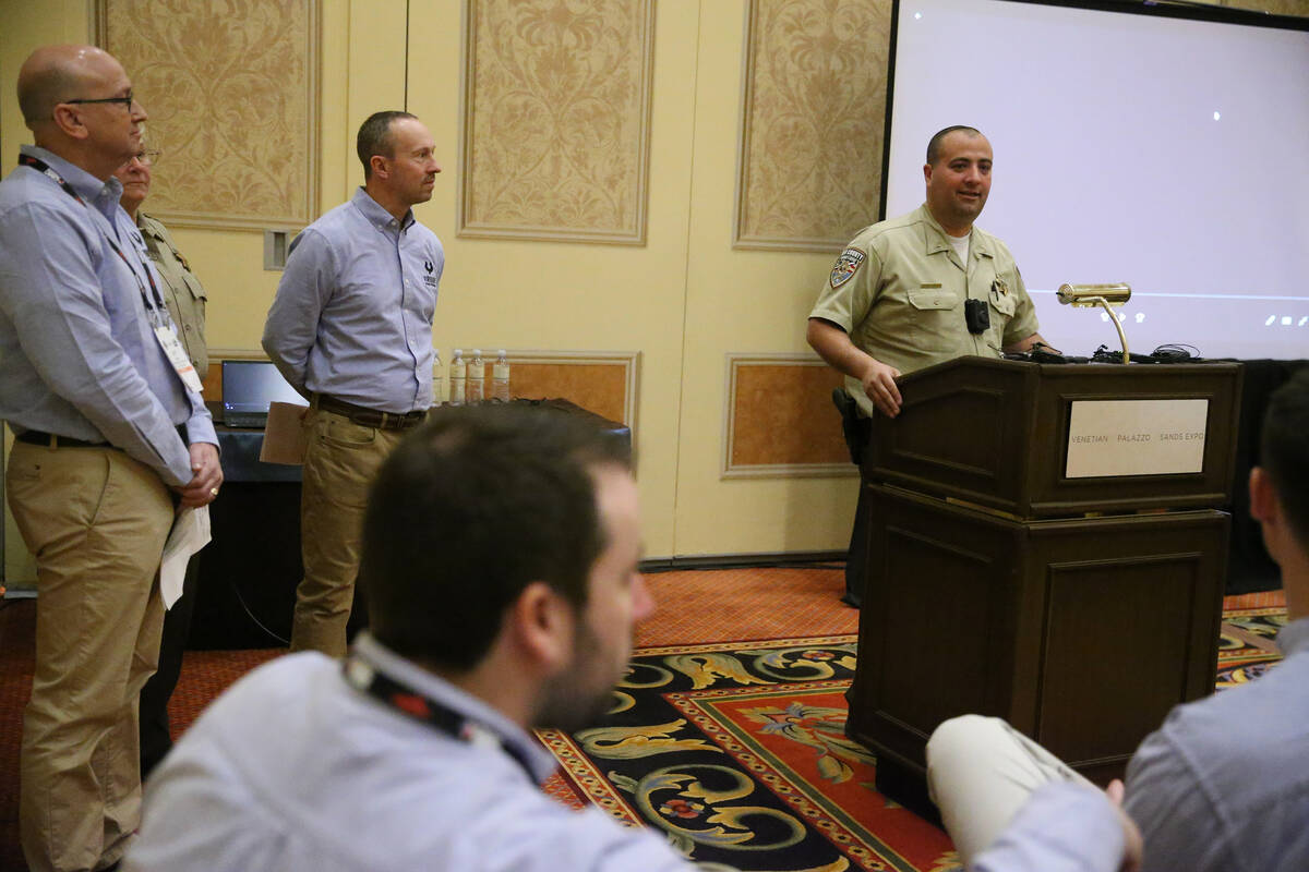 Nye County Sheriff Capt. David Boruchowitz, right, talks about using Viridian Weapon Technologi ...