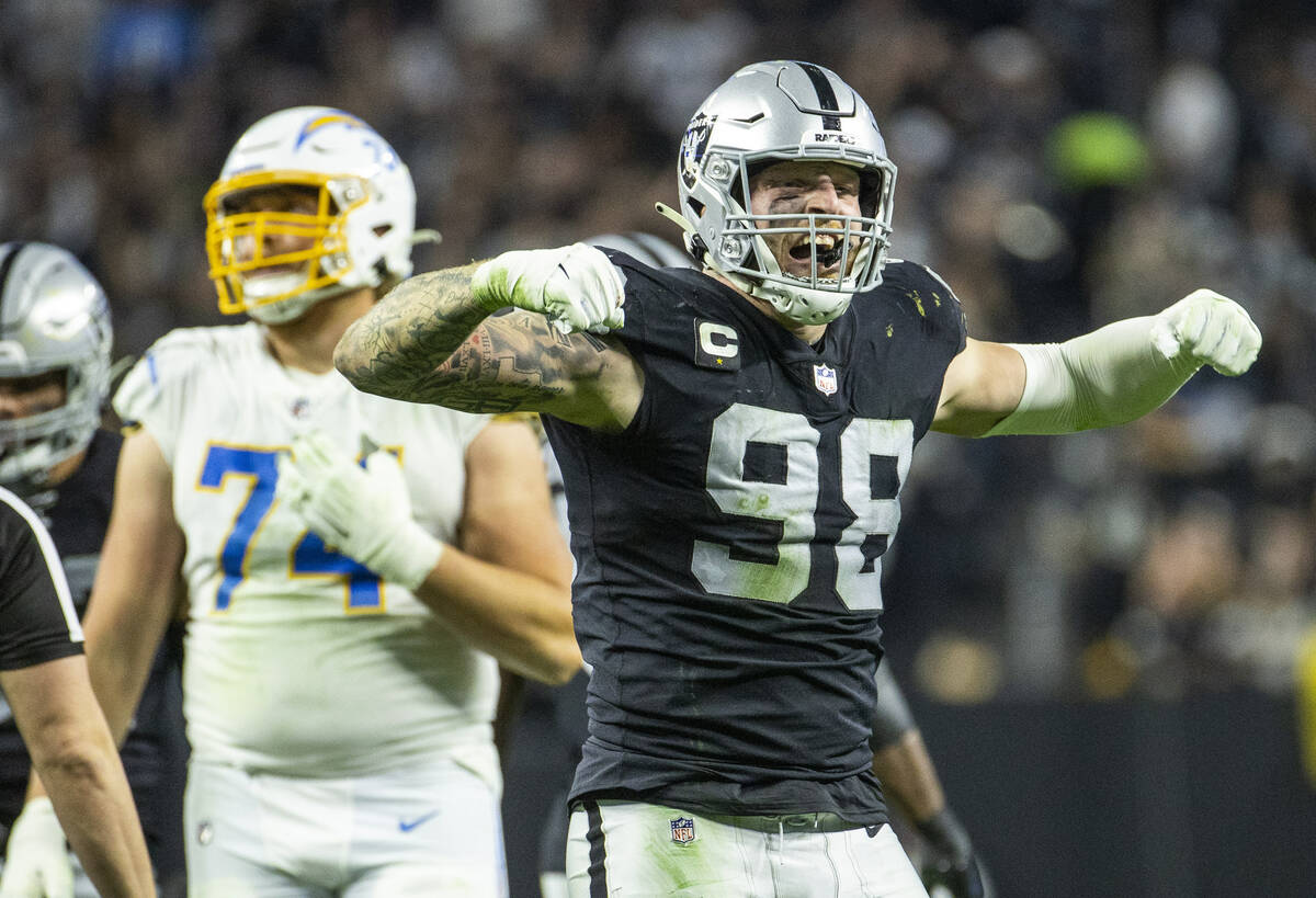 Raiders defensive end Maxx Crosby (98) celebrates another drive ending tackle versus the Los An ...