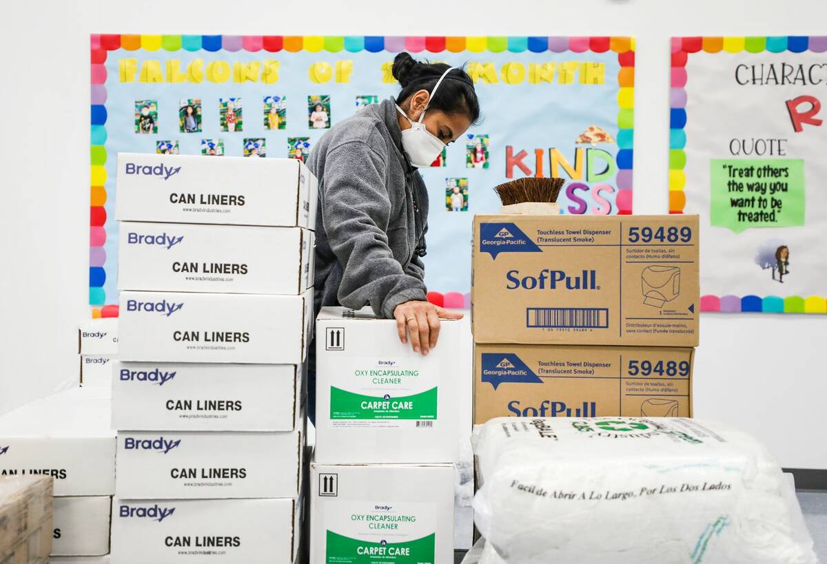 Head custodian Sonia Fernandez loads supplies on a cart at Ferron Elementary School, Monday, Ja ...