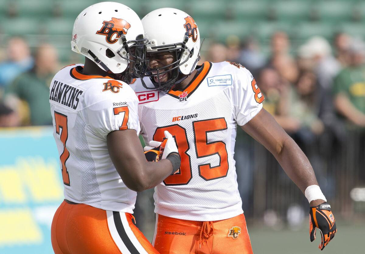 B.C. Lions' Lavelle Hawkins, left, and Shaquille Murray-Lawrence celebrate a touchdown against ...