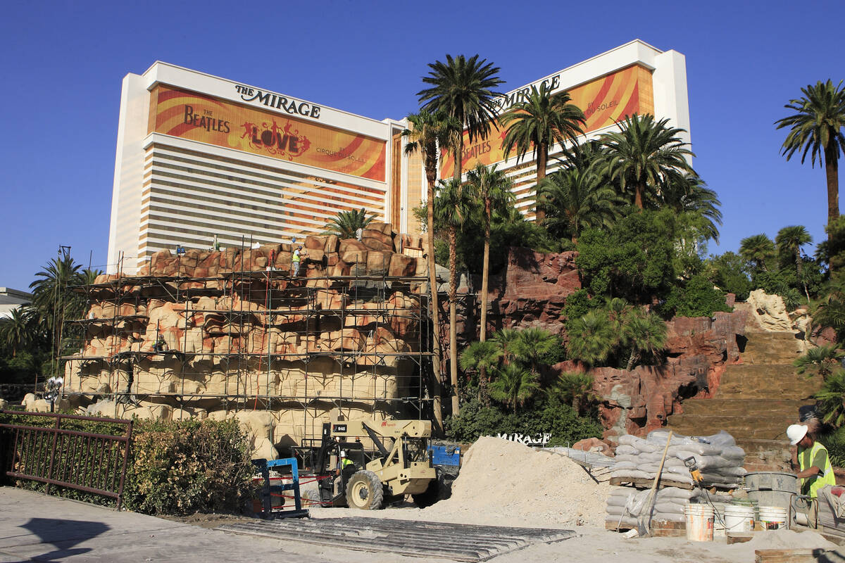 Scaffolding surrounds the volcano attraction that is currently being overhauled in front of The ...