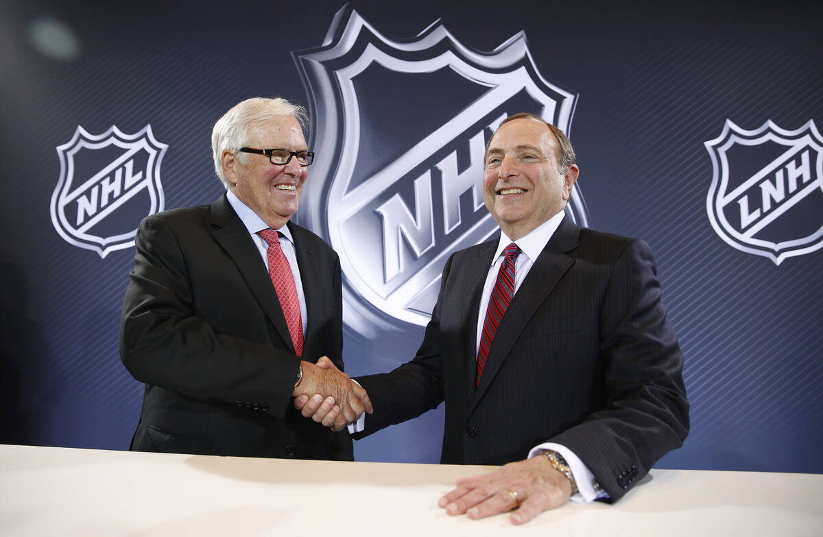 NHL Commissioner Gary Bettman, right, and Bill Foley pose for photographers during a news confe ...