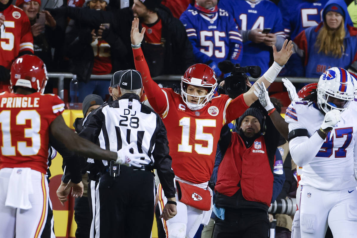 Kansas City Chiefs quarterback Patrick Mahomes (15) reacts after scoring on an 8-yard touchdown ...