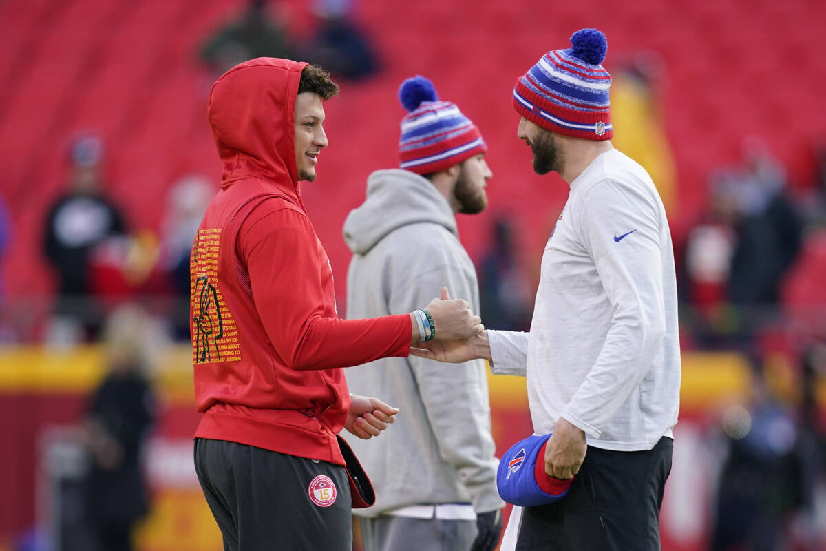 Kansas City Chiefs quarterback Patrick Mahomes, left, greets Buffalo Bills quarterback Josh All ...