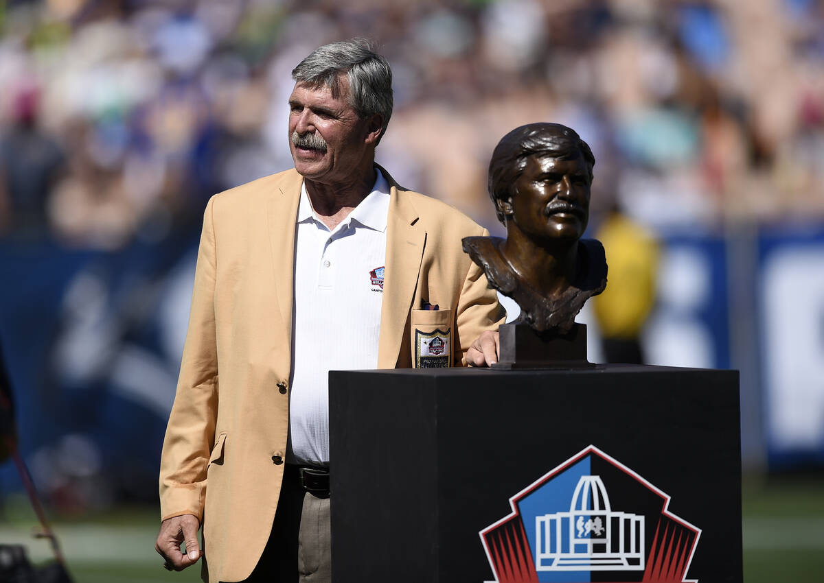 Former Rams team member Tom Mack stands with his bust during the Rams Hall of Fame Ring of Exce ...