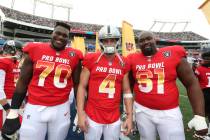 From left to right, AFC offensive guard Kelechi Osmele, AFC quarterback Derek Carr, and AFC cen ...