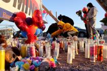 Kenia Ramos, 15, right, who was a classmate of crash victim Bryan Axel Zacarias, 15, prepares t ...