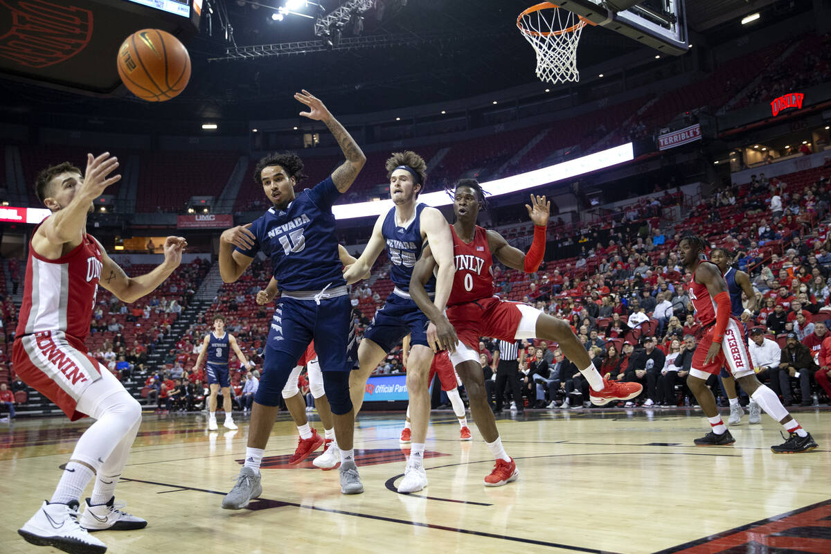 UNLV Rebels guard Jordan McCabe (5) reaches for a ball knocked down by forward Victor Iwuakor ( ...