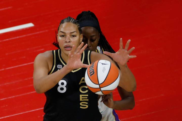 Las Vegas Aces center Liz Cambage (8) receives a ball against Los Angeles Sparks forward/center ...