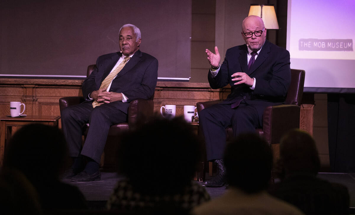 District Judge Tim Williams, right, and retired Justice Michael Douglas participate in a Black ...