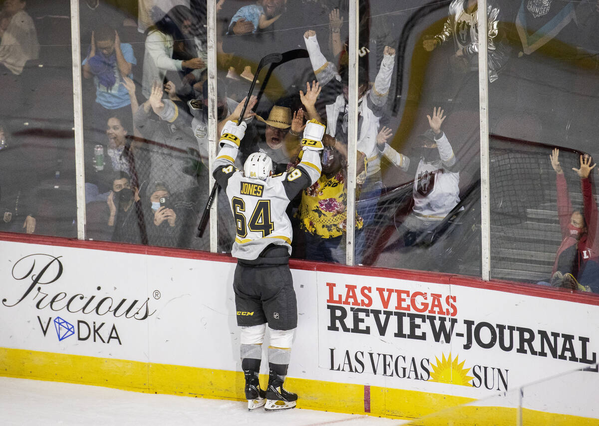 Silver Knights center Ben Jones (64) celebrates with fans after scoring a third period goal aga ...