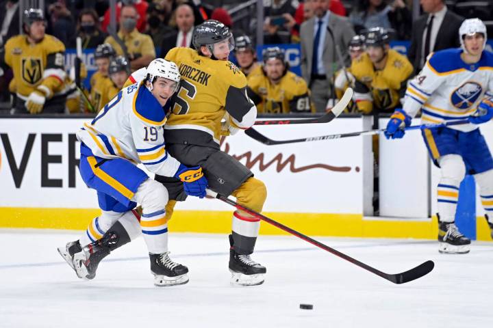 Buffalo Sabres center Peyton Krebs (19) and Vegas Golden Knights defenseman Kaedan Korczak (6) ...