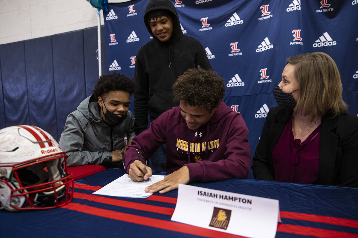 Liberty’s Isaiah Hampton signs a letter of intent to play football at University of Minn ...