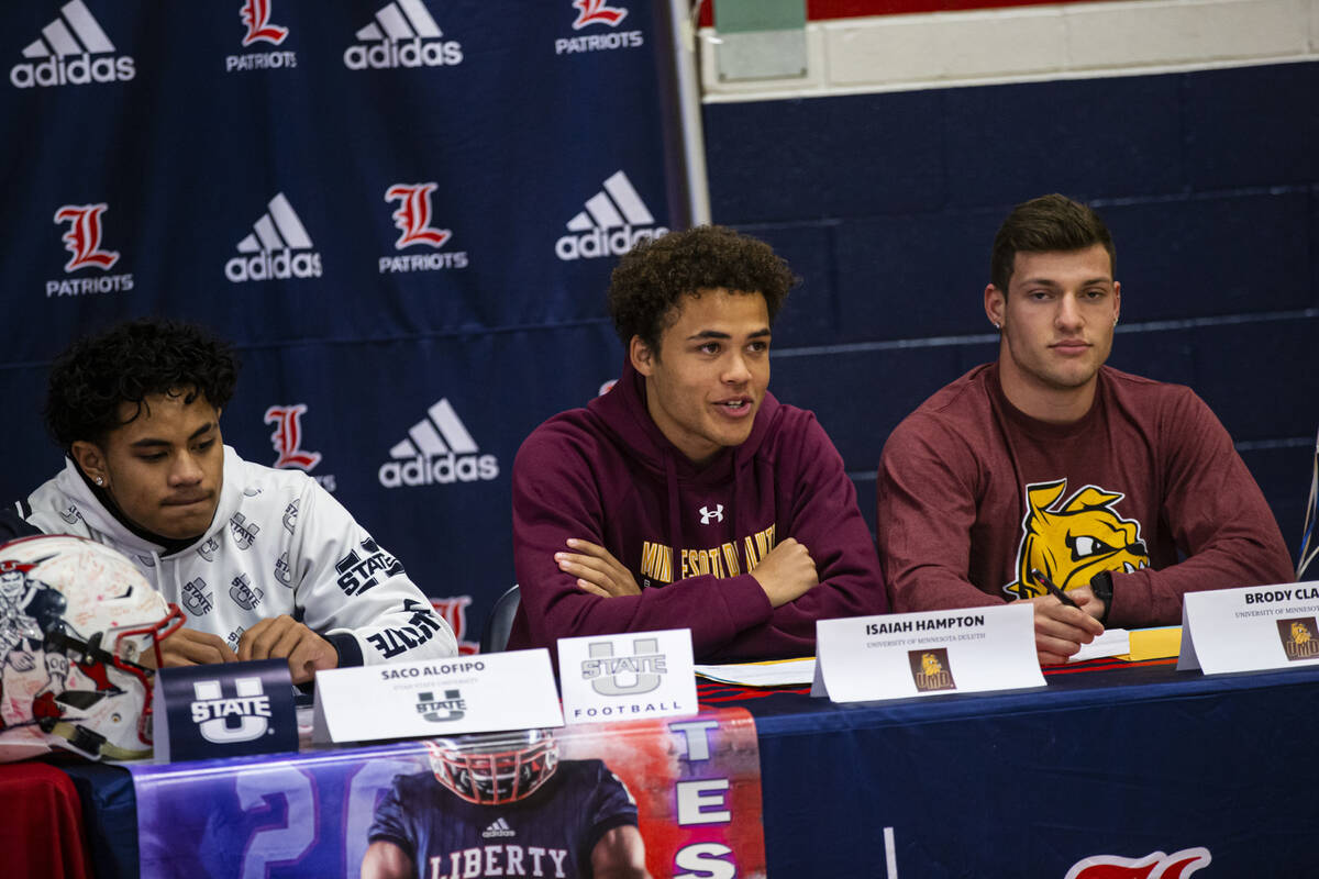 Liberty’s Isaiah Hampton, center, who is committing to University of Minnesota Duluth al ...