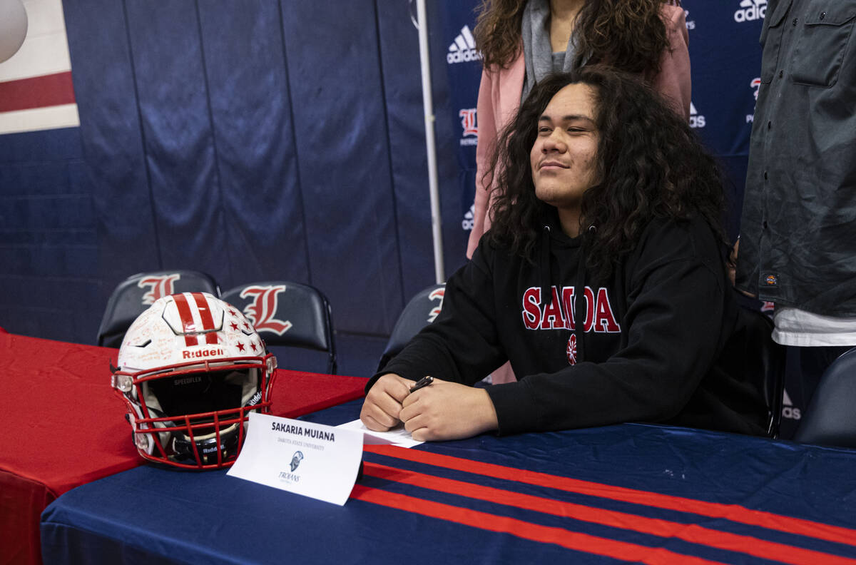 Liberty’s Sakaria Muaina, who is committing to Dakota State University, poses for a phot ...