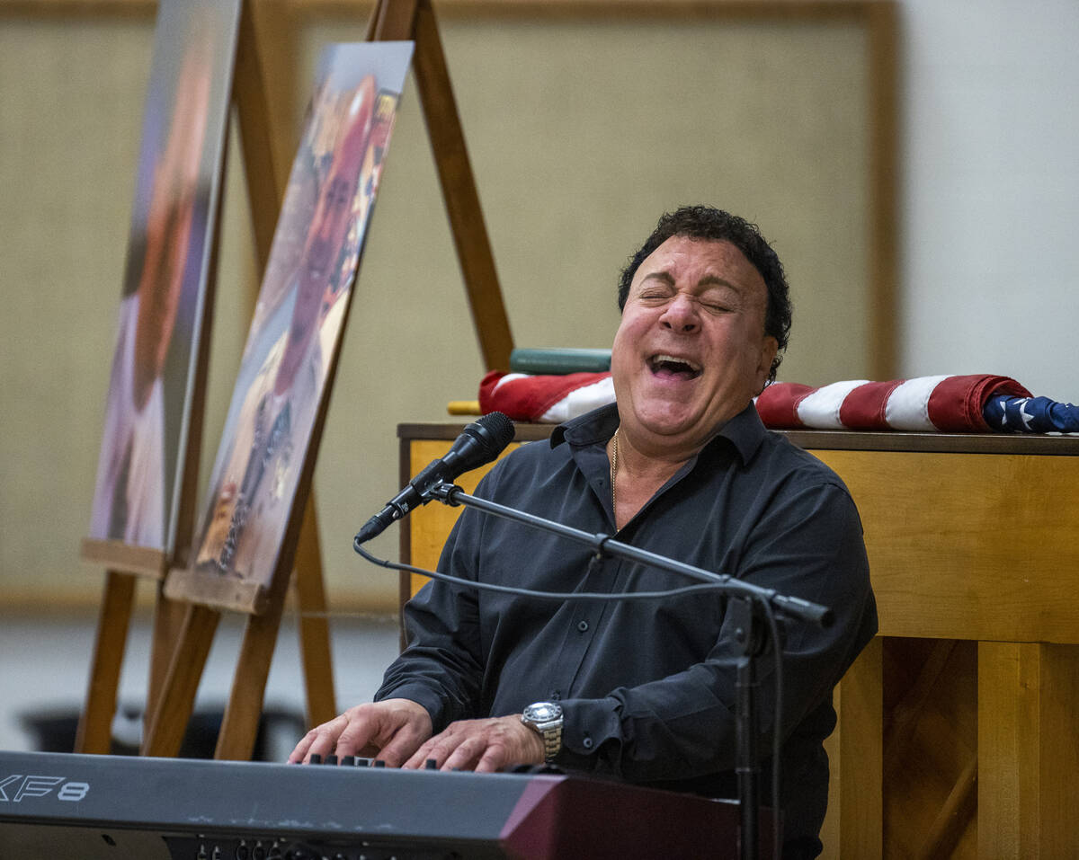 Performer Frankie Scinta sings a Beatles song during a public memorial service for former Metro ...
