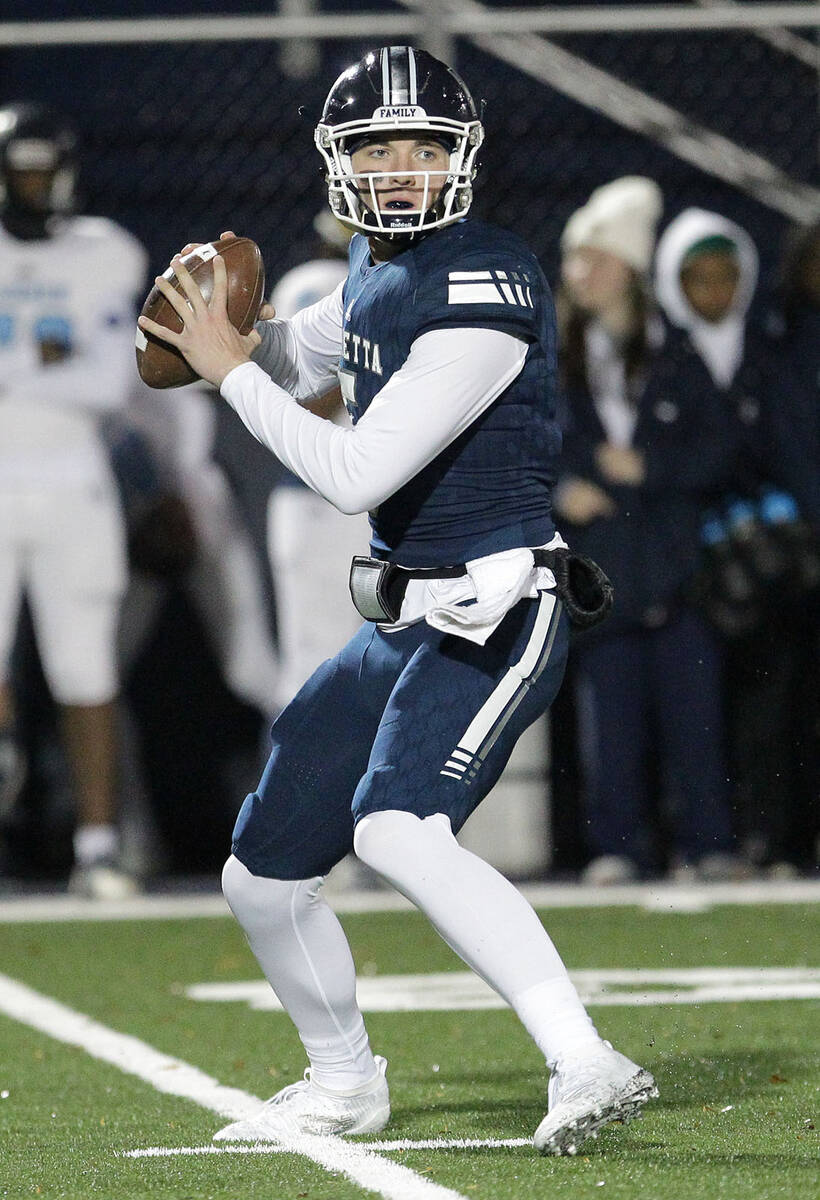 Marietta senior QB Harrison Bailey (5) moves around the pocket looking for one of his many rece ...