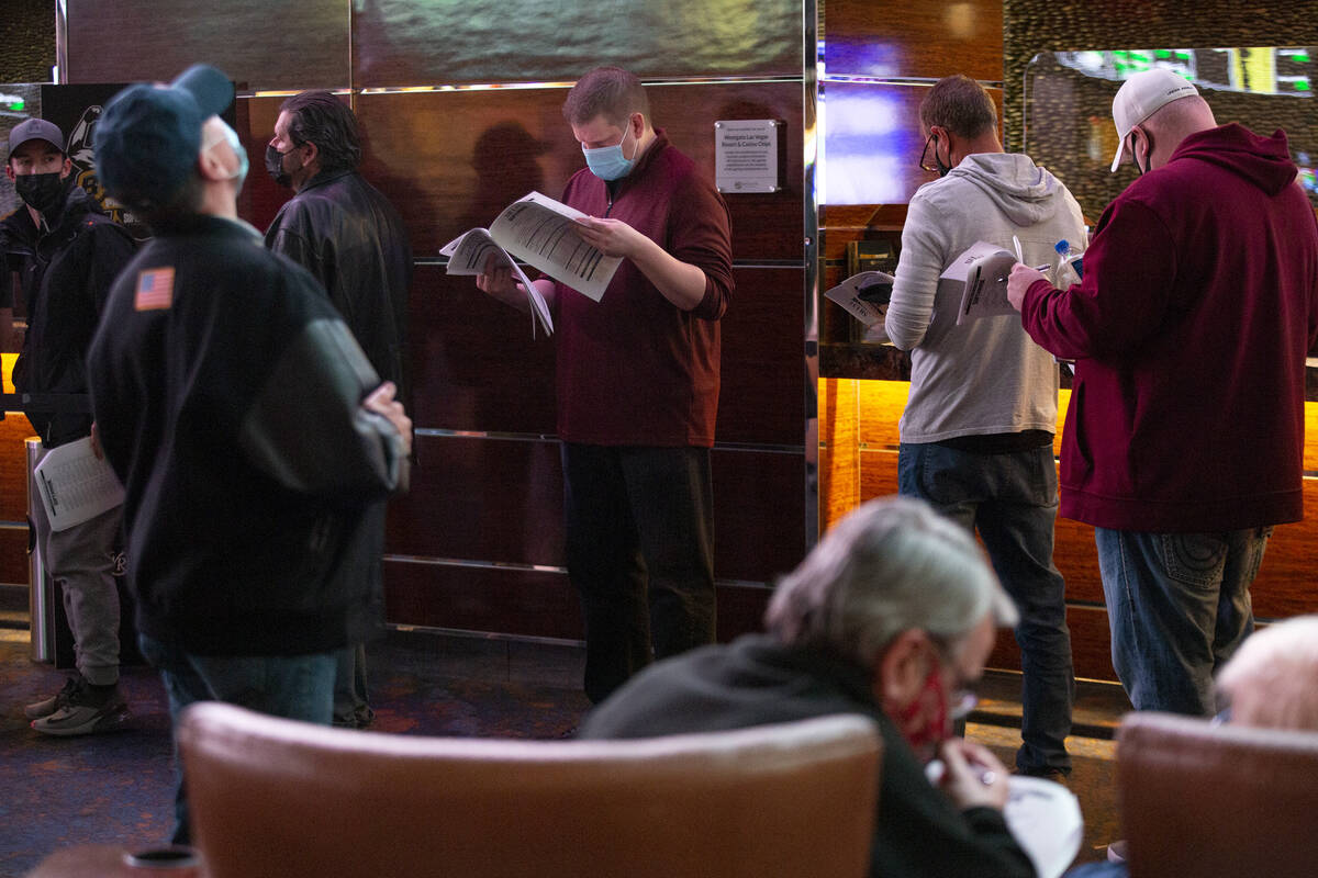 Bettors wait in line just after Super Bowl prop bets are released on the board at the Westgate ...