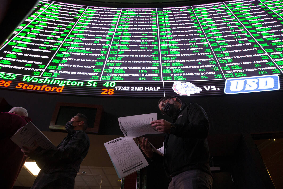 Bettors wait in line just after Super Bowl prop bets are released on the board at the Westgate ...