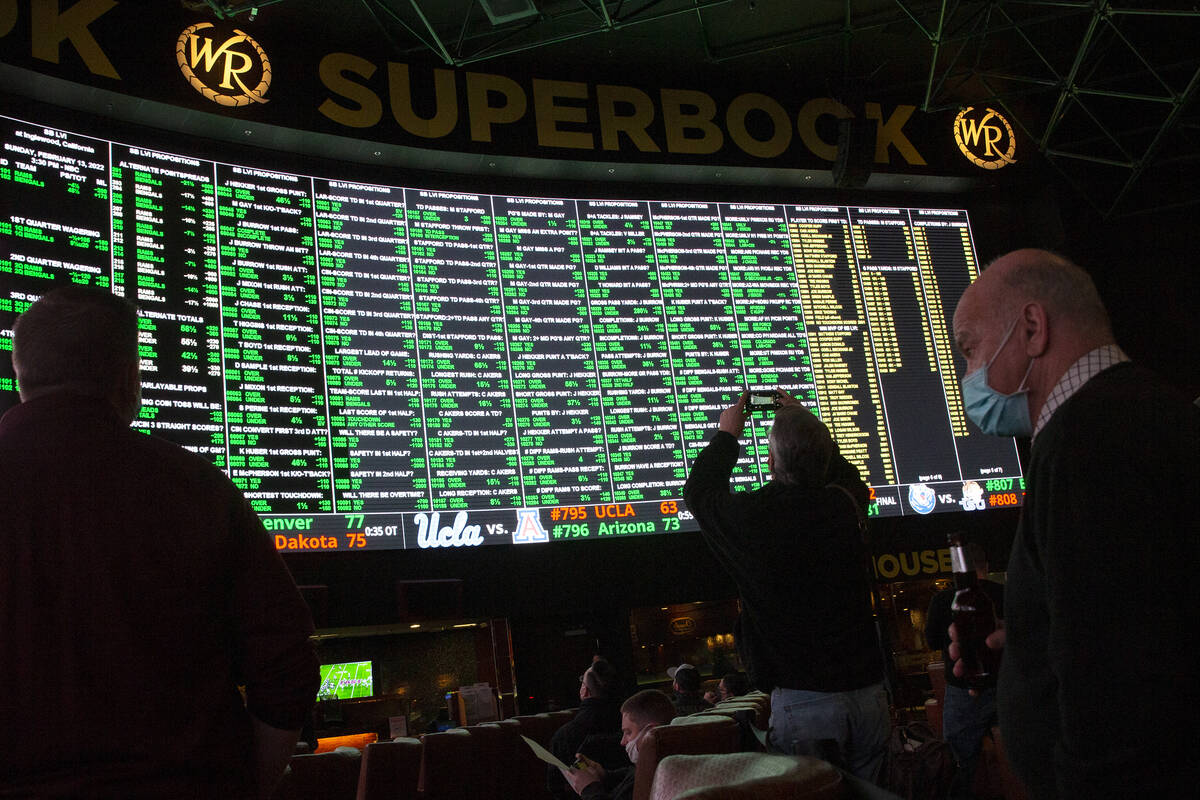 Bettors check the board as Super Bowl prop bets are released at the Westgate SuperBook on Thurs ...