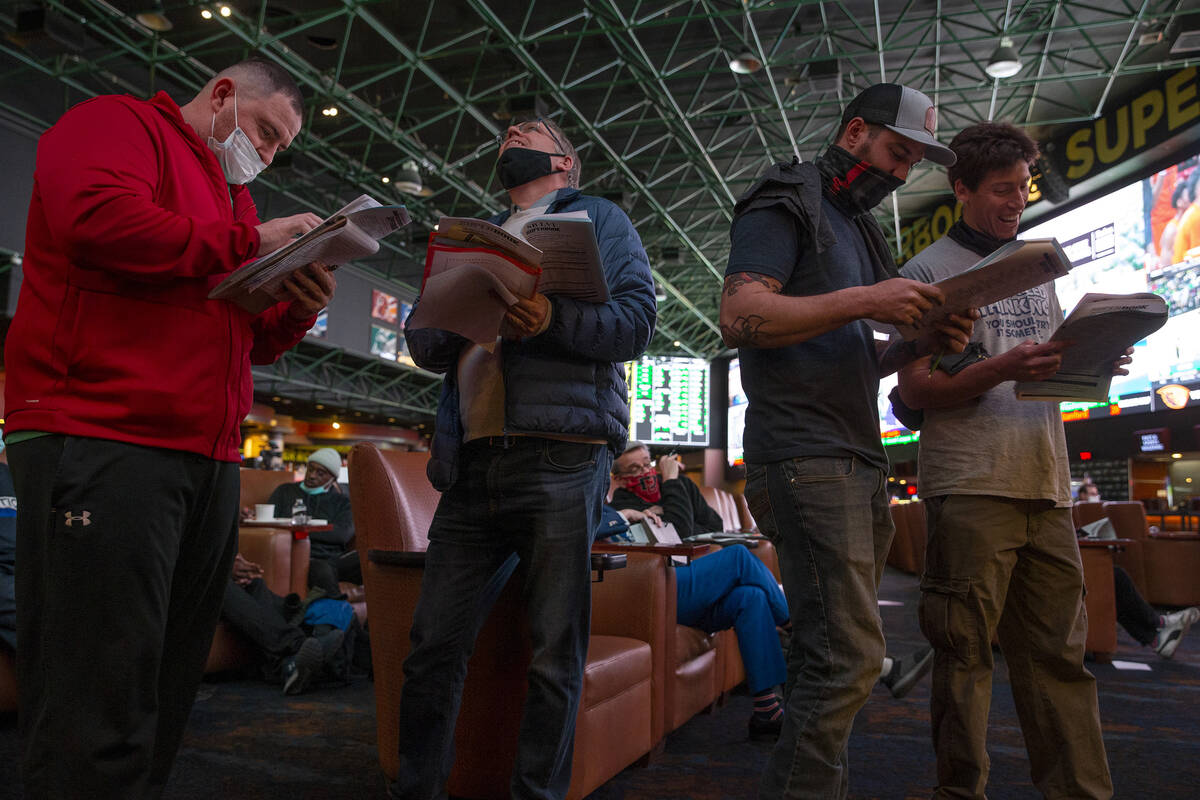 Bettors wait in line to place Super Bowl prop bets on the first night they are released on the ...