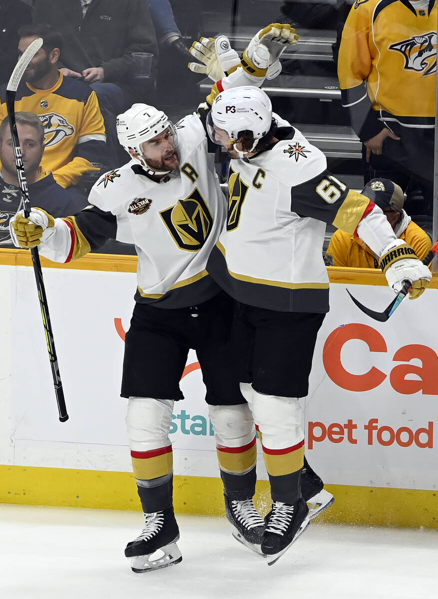 Vegas Golden Knights defenseman Alex Pietrangelo (7) celebrates with right wing Mark Stone (61) ...