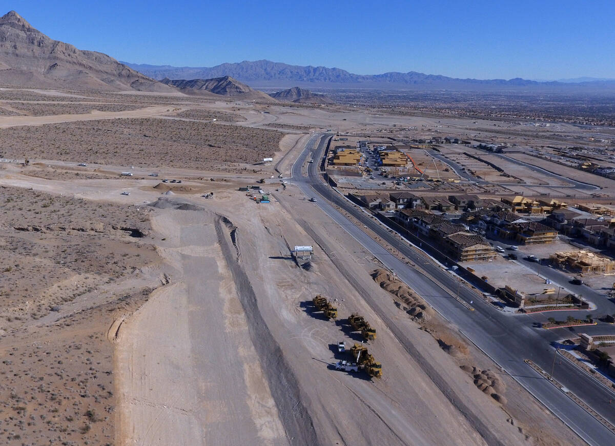 Heavy construction equipments are moving around in the distance as seen from Far Hills Avenue o ...