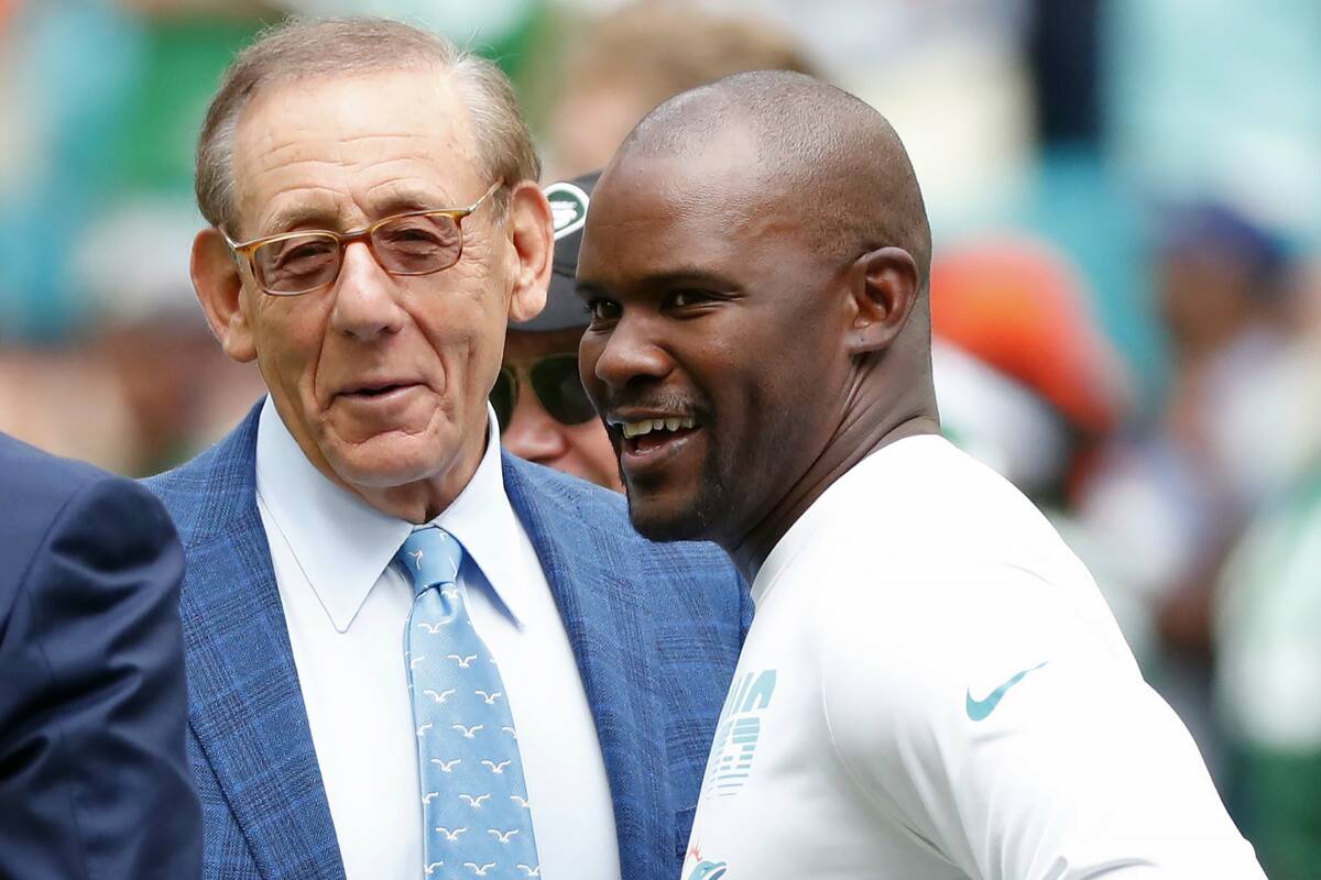 FILE -Miami Dolphins head coach Brian Flores talks to Miami Dolphins owner Stephen M. Ross duri ...