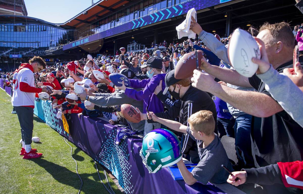 Kansas City Chiefs quarterback Patrick Mahomes signs autographs for fans during AFC Pro Bowl te ...