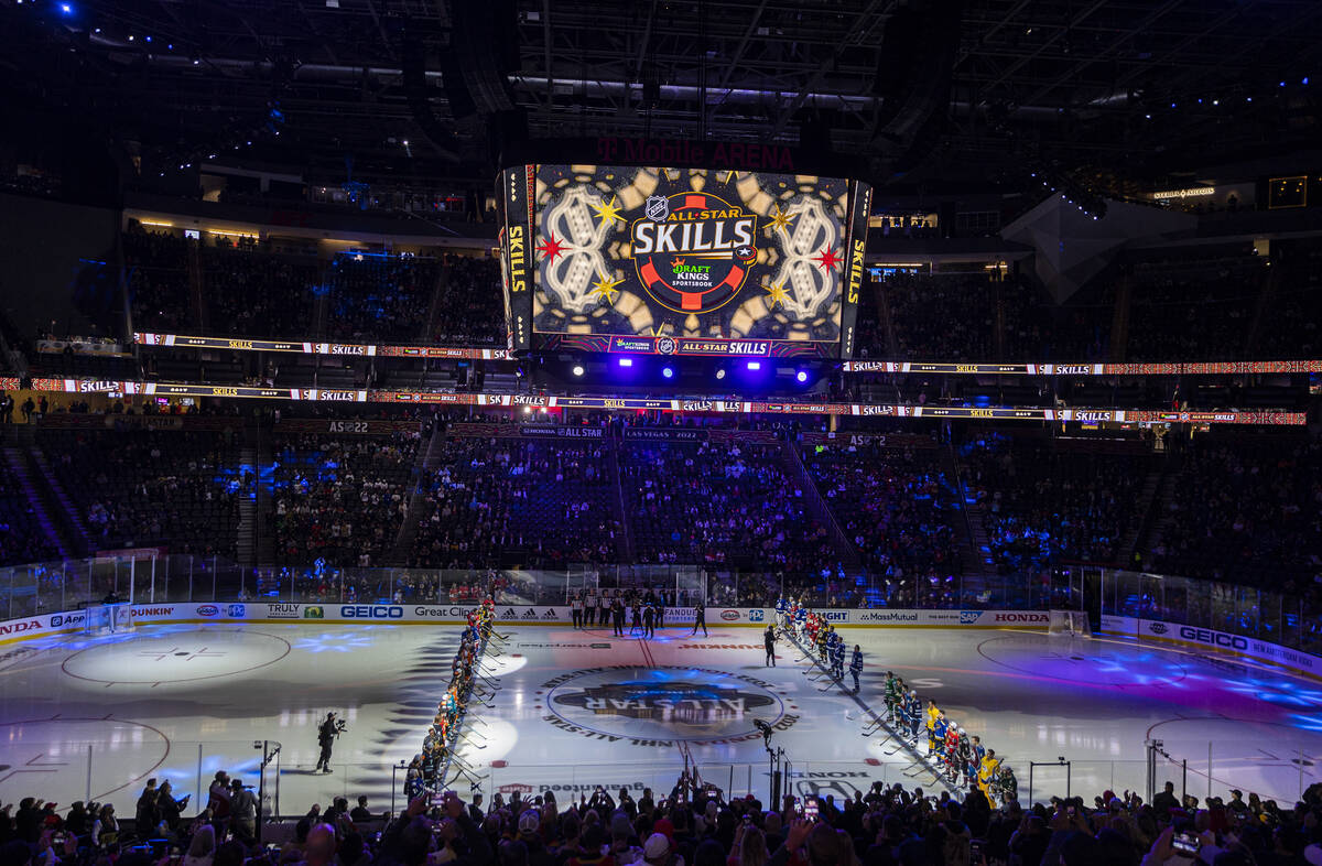Players line the ice before the start of the NHL All-Star skills competition on Friday, Feb. 4, ...