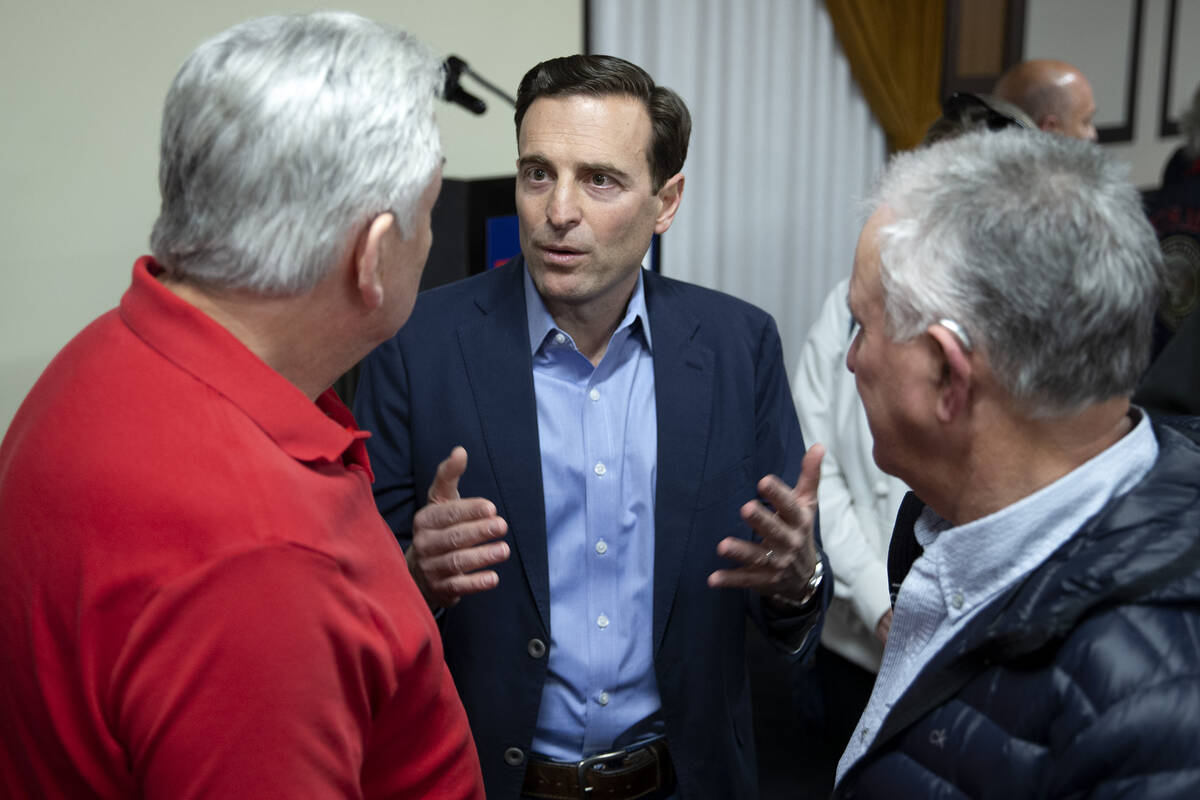 Republican U.S. Senate candidate Adam Laxalt talks to supporters after speaking at a campaign e ...