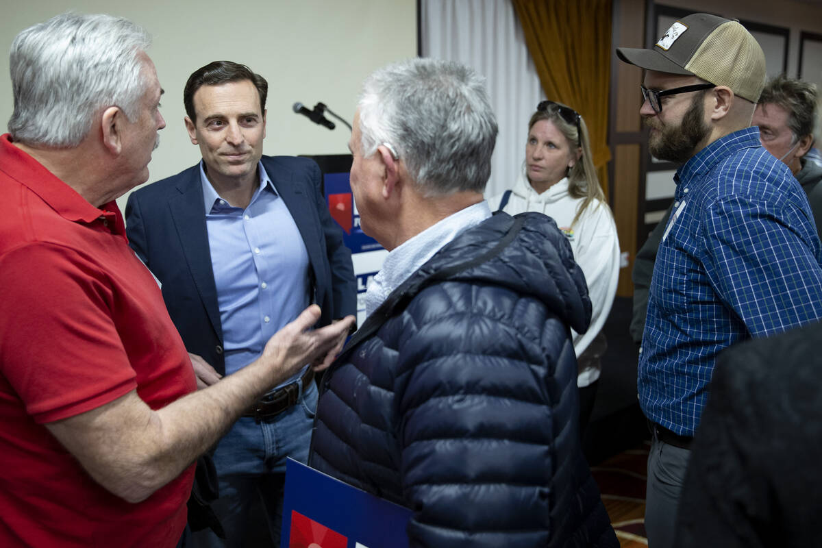 Republican U.S. Senate candidate Adam Laxalt talks to supporters after speaking at a campaign e ...
