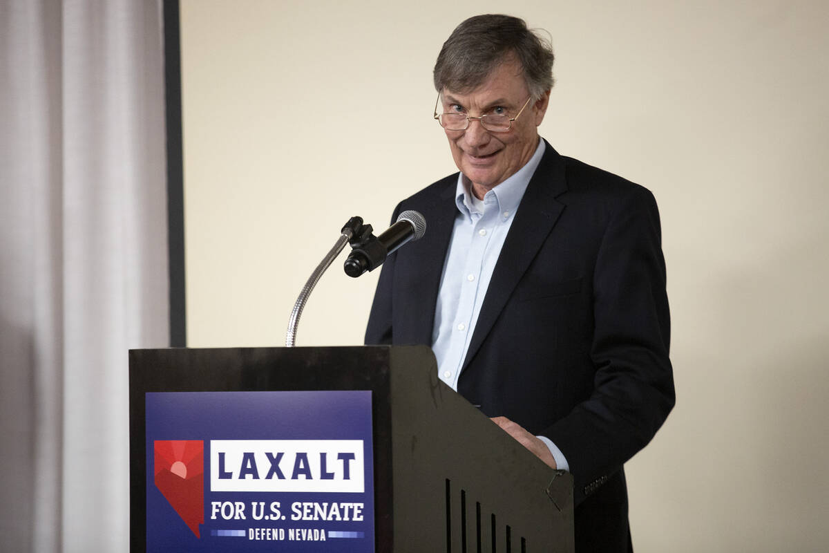 Tim Macy, chairman of the board for Gun Owners of America, speaks during a campaign event for R ...