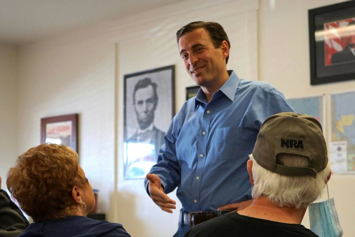 Adam Laxalt talks to a supporter at the Douglas County Republican Party Headquarters on the fin ...