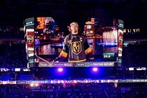 Fans watch a pre-recorded segment at the Bellagio Fountains featuring Golden Knights right wing ...