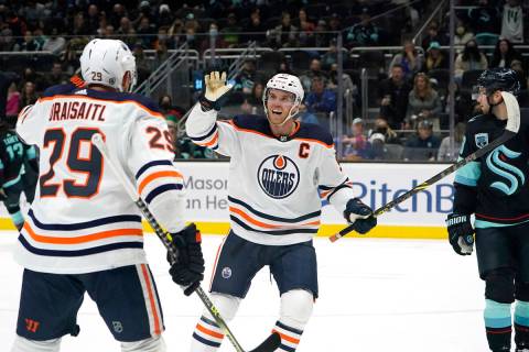 Edmonton Oilers' Connor McDavid reacts to a goal by the team with Leon Draisaitl (29) against t ...