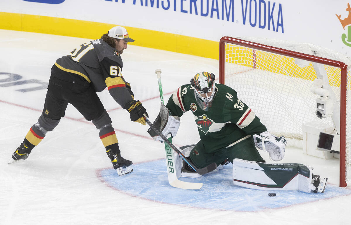 Golden Knights right wing Mark Stone (61) shoots on Minnesota Wild goalie Cam Talbot (33) durin ...