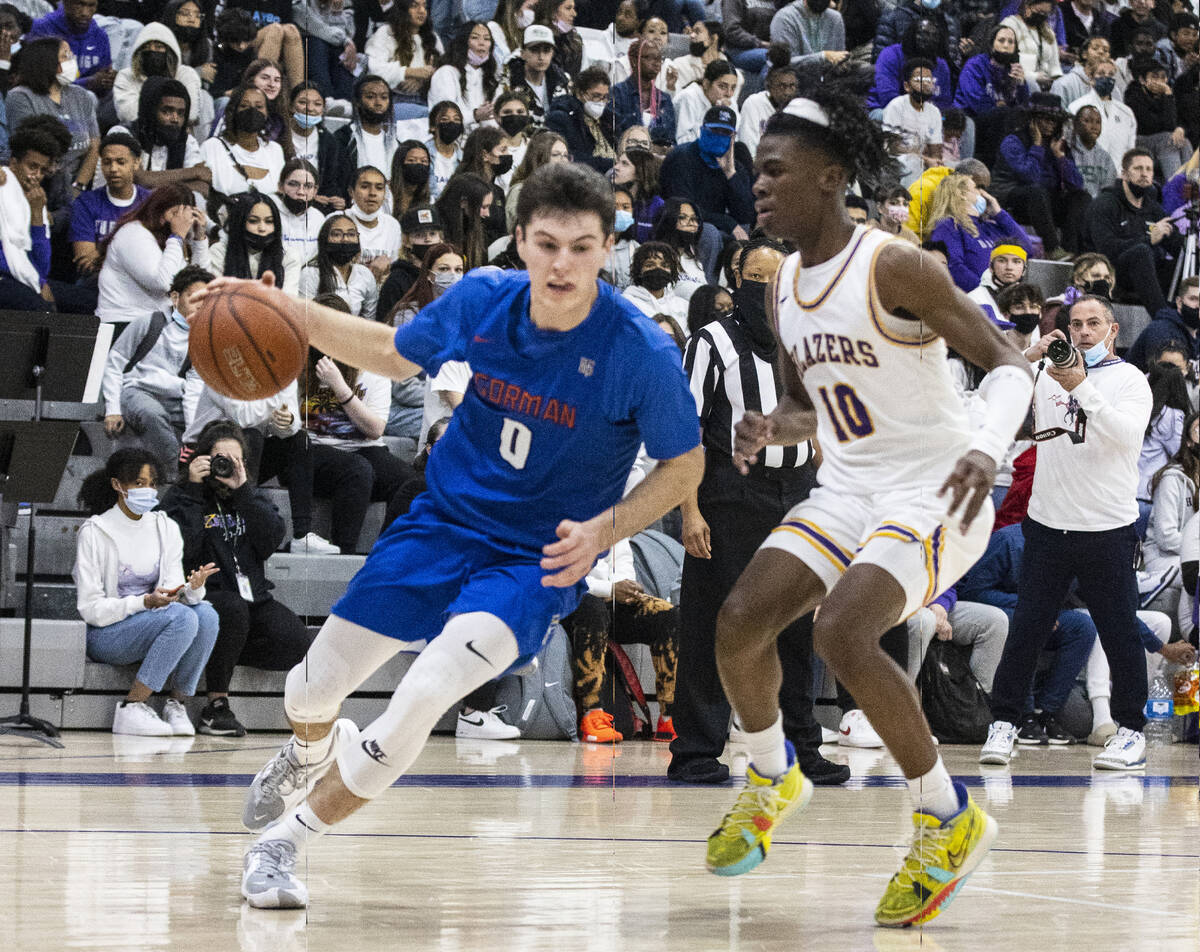 Bishop Gorman’s Ryan Abelman (0) drives past Durango High’s Tylen Riley (10) duri ...