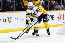 Vegas Golden Knights right wing Keegan Kolesar (55) moves the puck in front of Nashville Predat ...