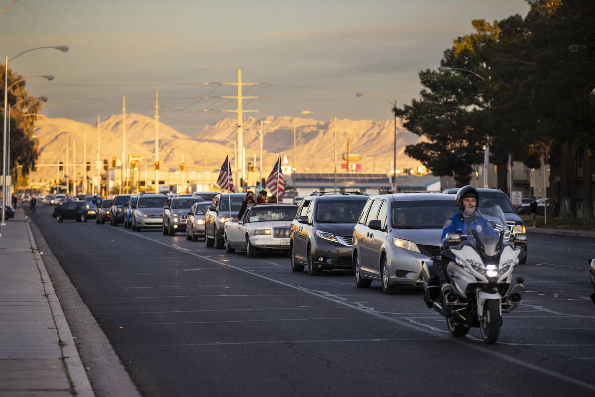 North Las Vegas police escort a vehicle caravan in memory of the seven Zacarias family members ...