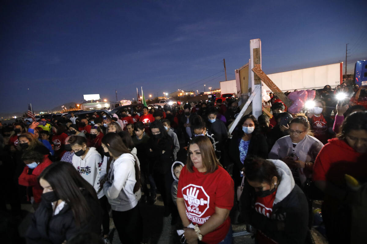 People gather for a vigil, Saturday, Feb. 5, 2022,ʩn honor of a six-vehicle crash victims ...