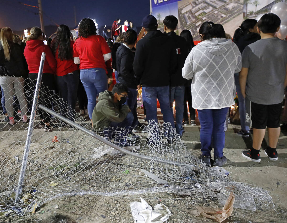 People gather for a vigil, Saturday, Feb. 5, 2022, in honor of a six-vehicle crash victims at n ...