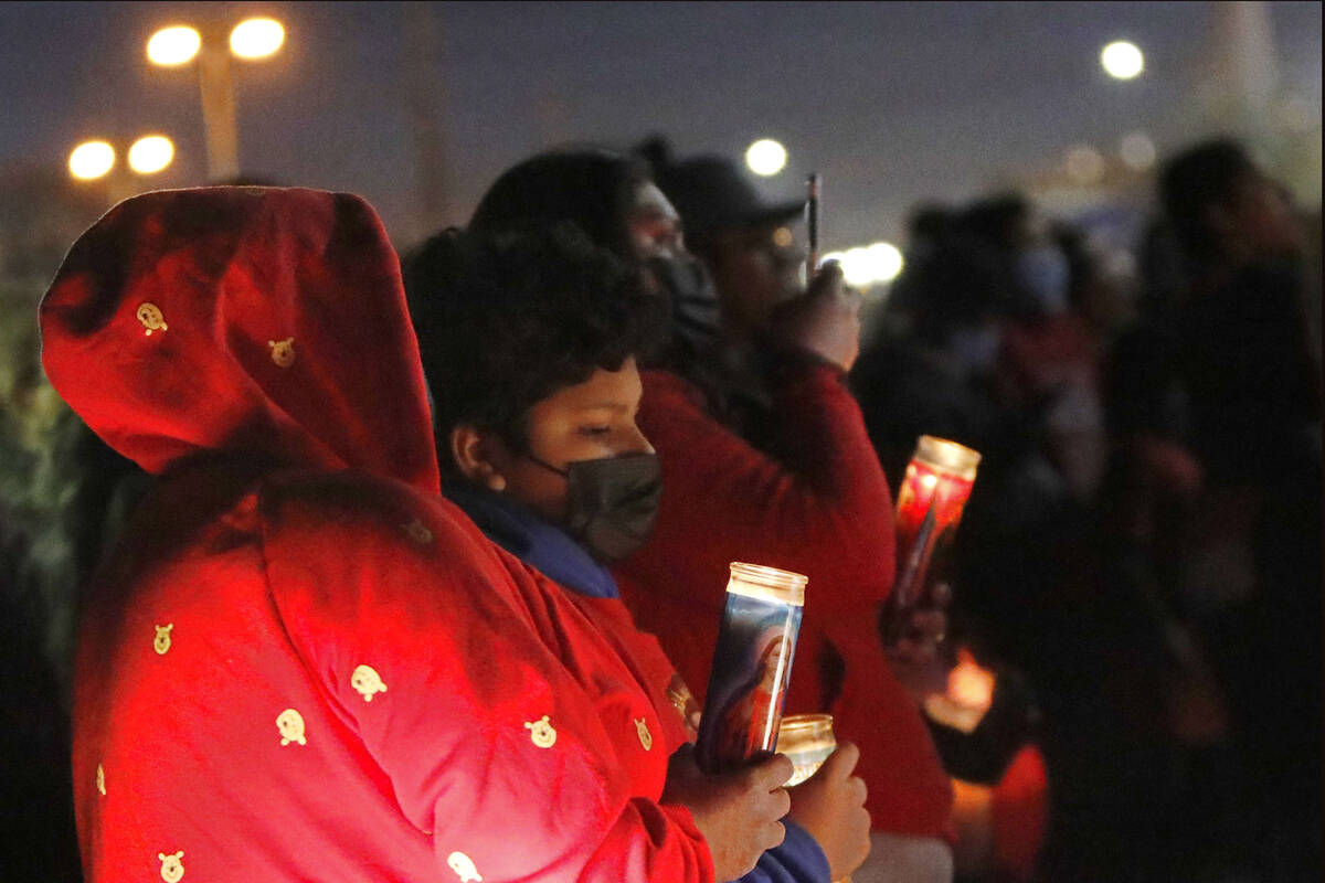 People gather for a vigil, Saturday, Feb. 5, 2022, in the aftermath of a six-vehicle crash at n ...