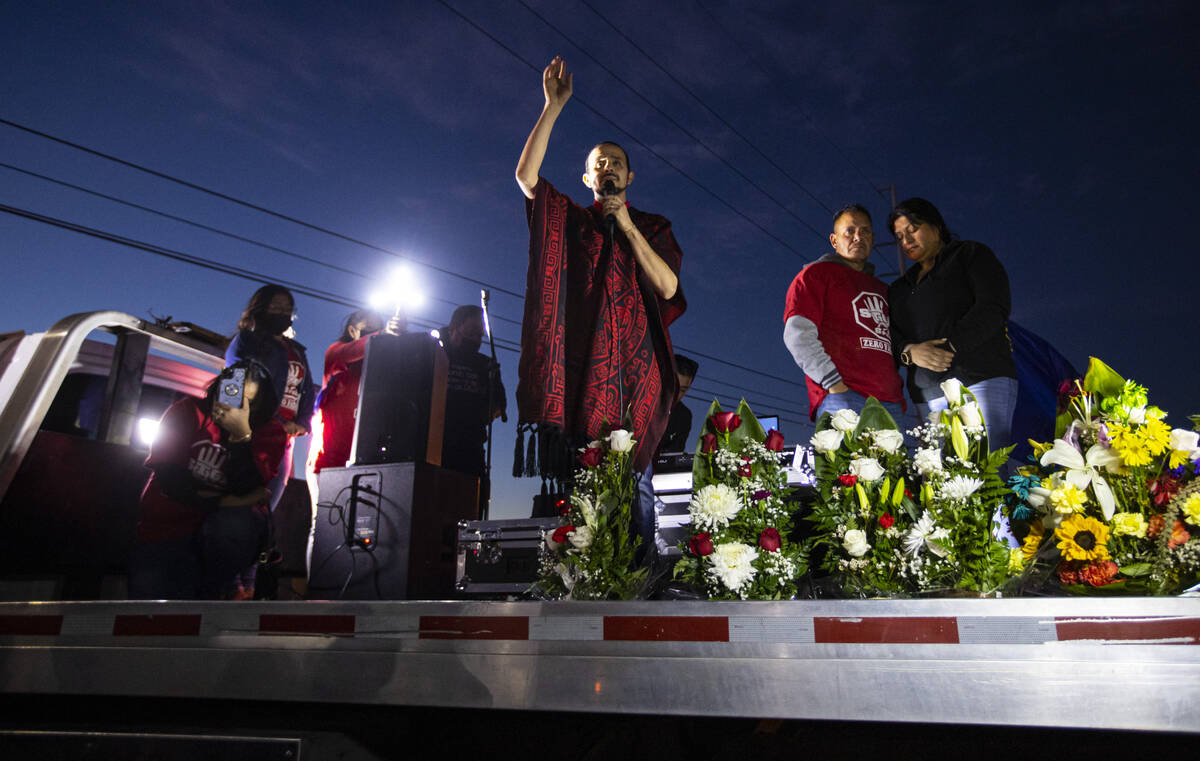 Pastor Marko Gamboa, center left, leads a seven minute moment of silence alongside Jesus Mejia- ...